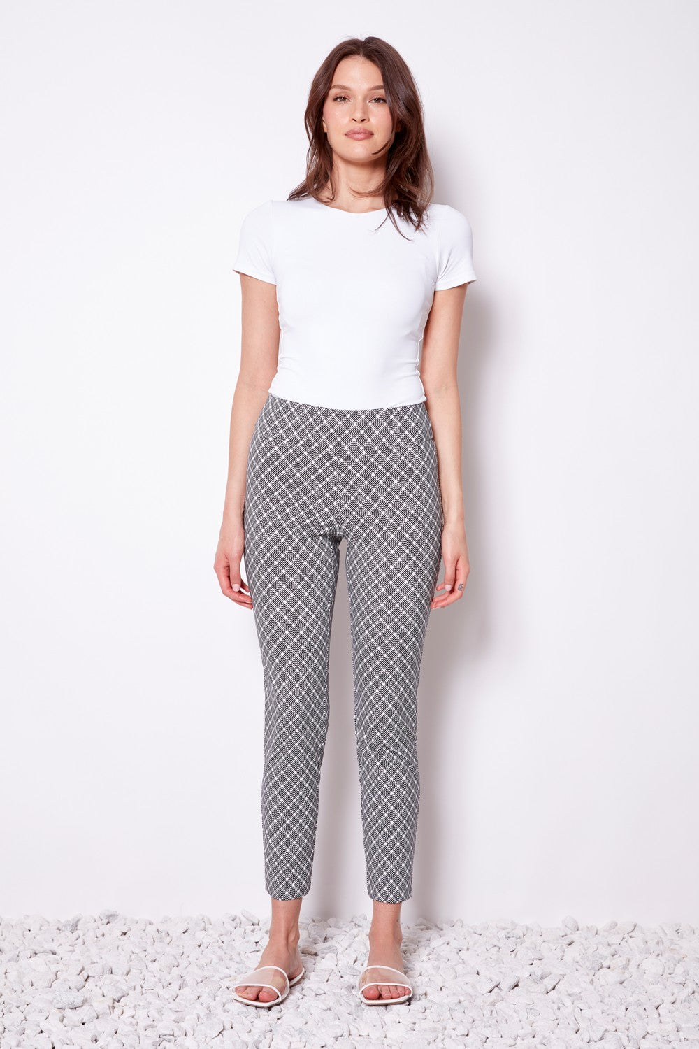 black and white geometric slim pant with white tee worn by model 