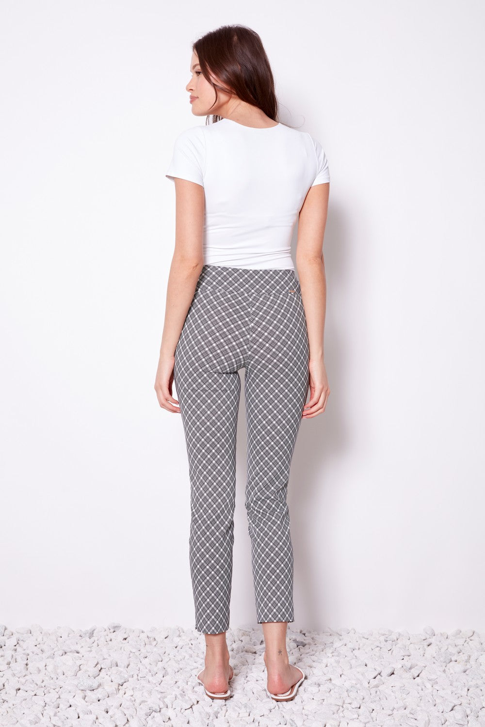 black and white geometric slim pant with white tee worn by model back view