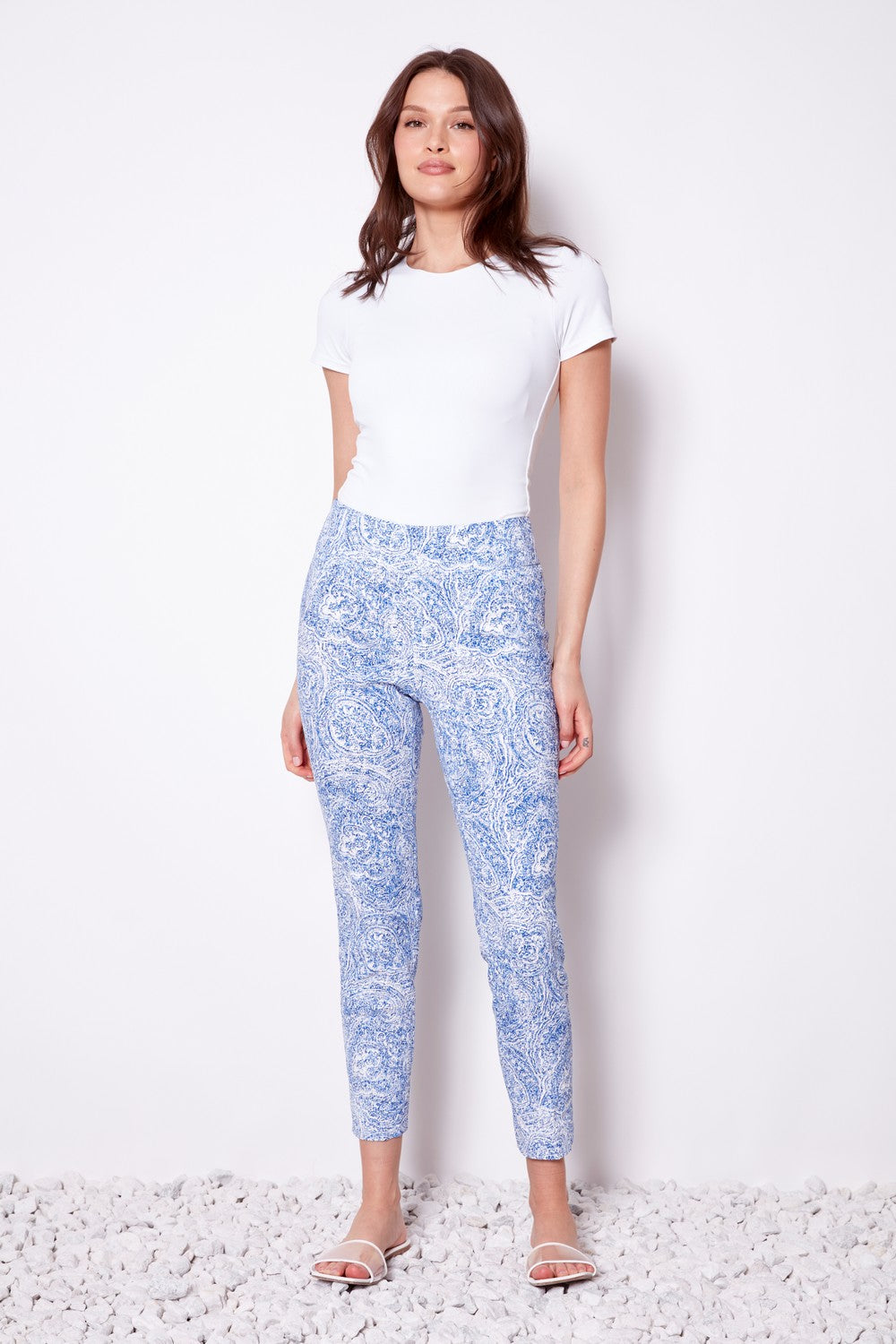 blue print pants and white top worn by model 