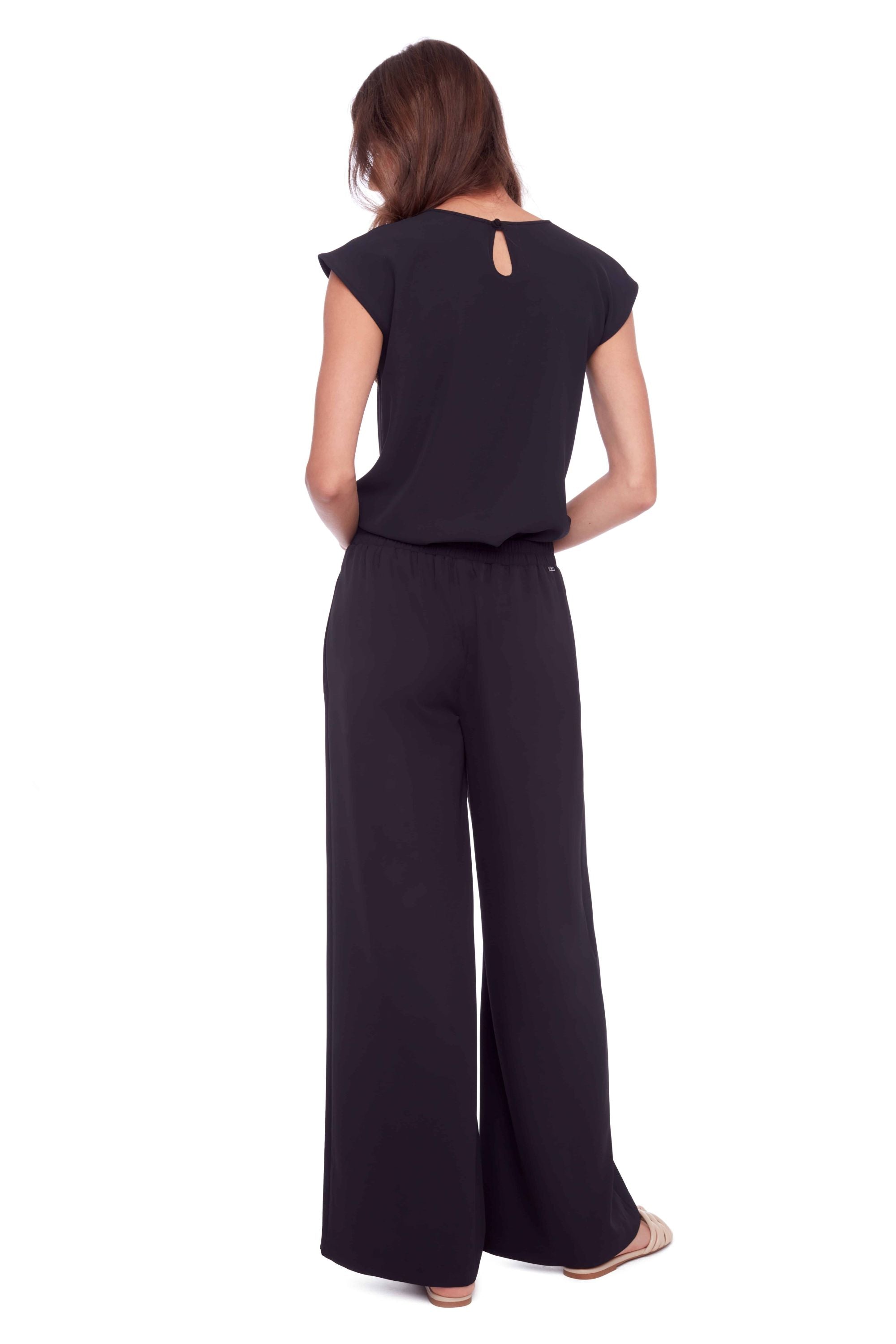 womens high waist wide leg black pants and black top worn by model back view