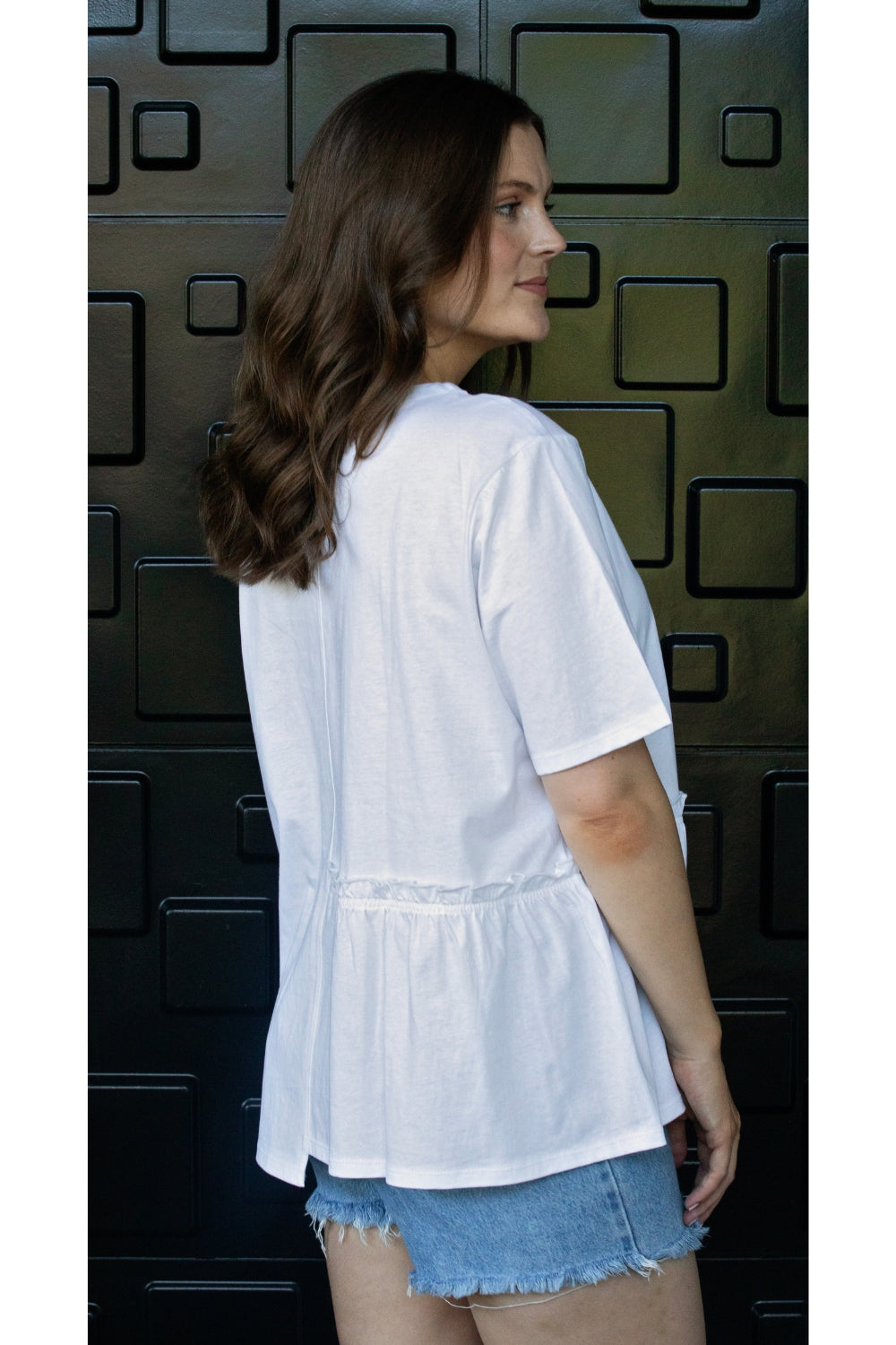 womens tee with gather detailing in white worn by model side view