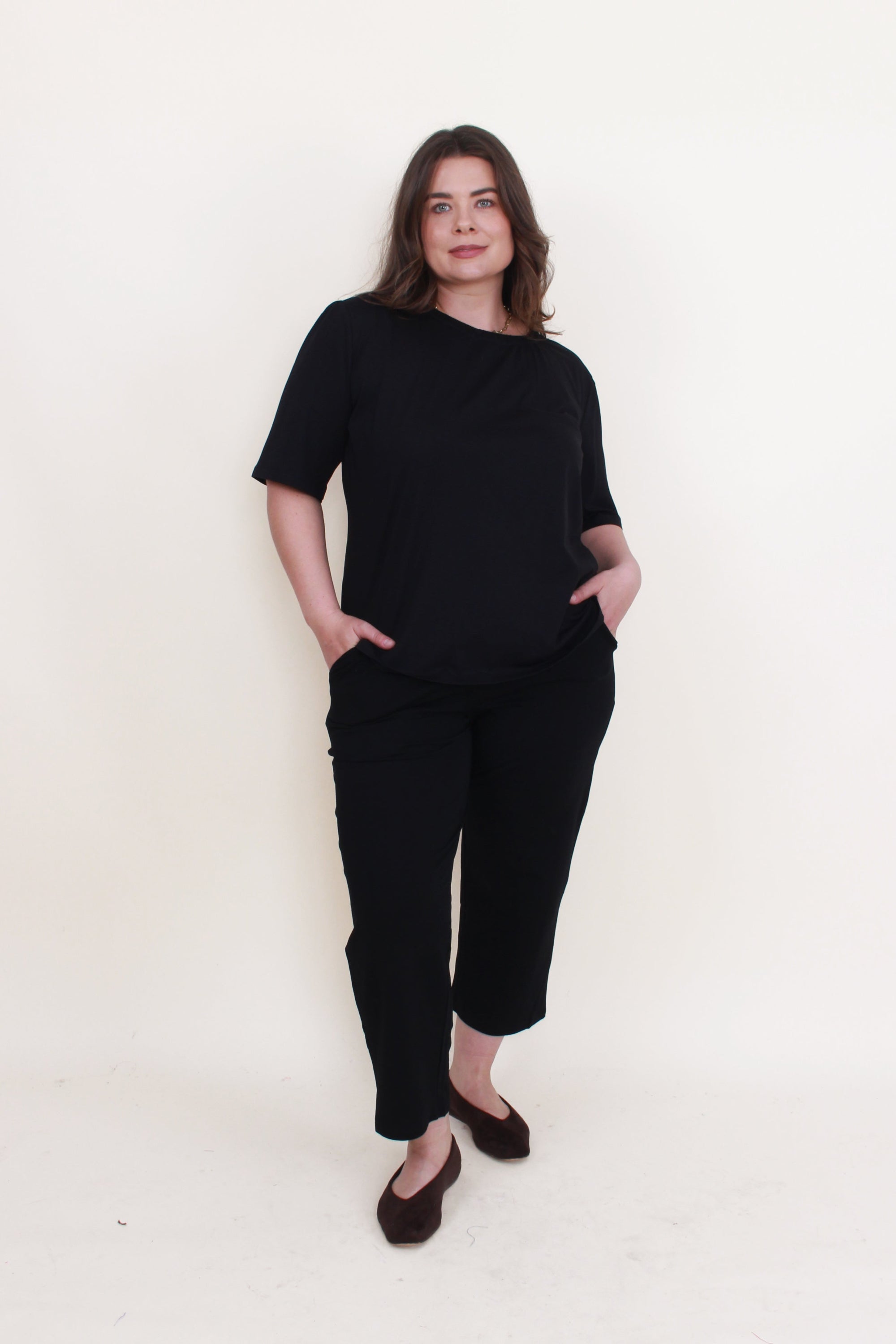 womens cropped black pant with black top worn by model 