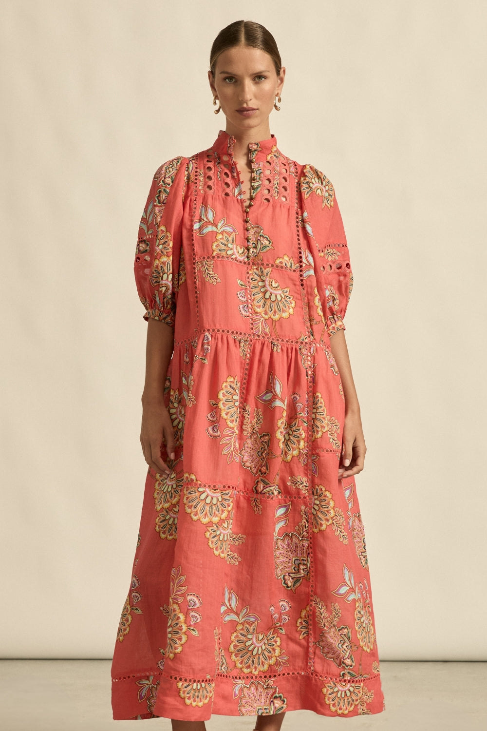 maxi dress in melon with oriental print worn by model 