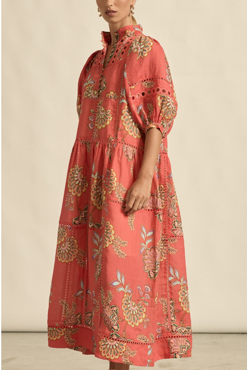 maxi dress in melon with oriental print worn by model 