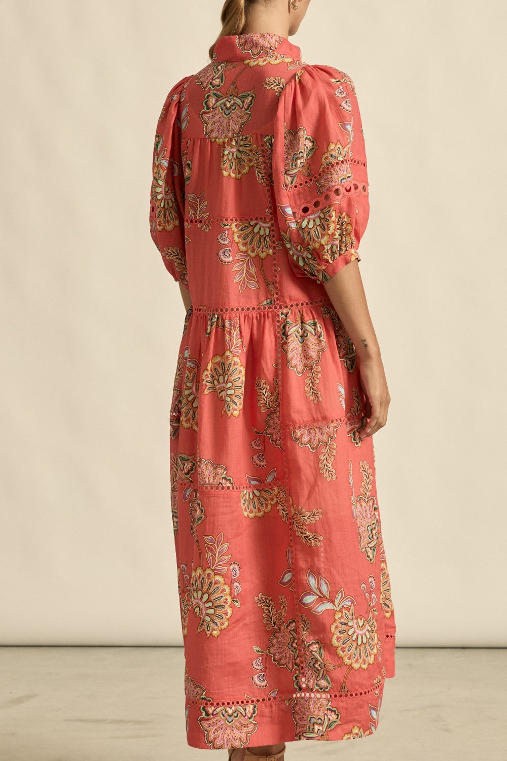 maxi dress in melon with oriental print worn by model back view