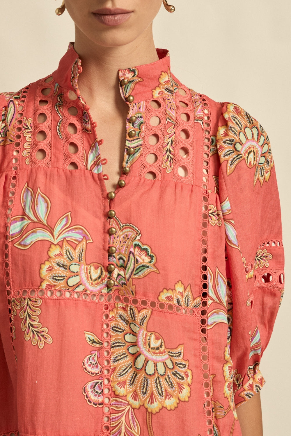 maxi dress in melon with oriental print worn by model close up