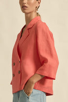 womens double breasted jacket in melon worn by model side view