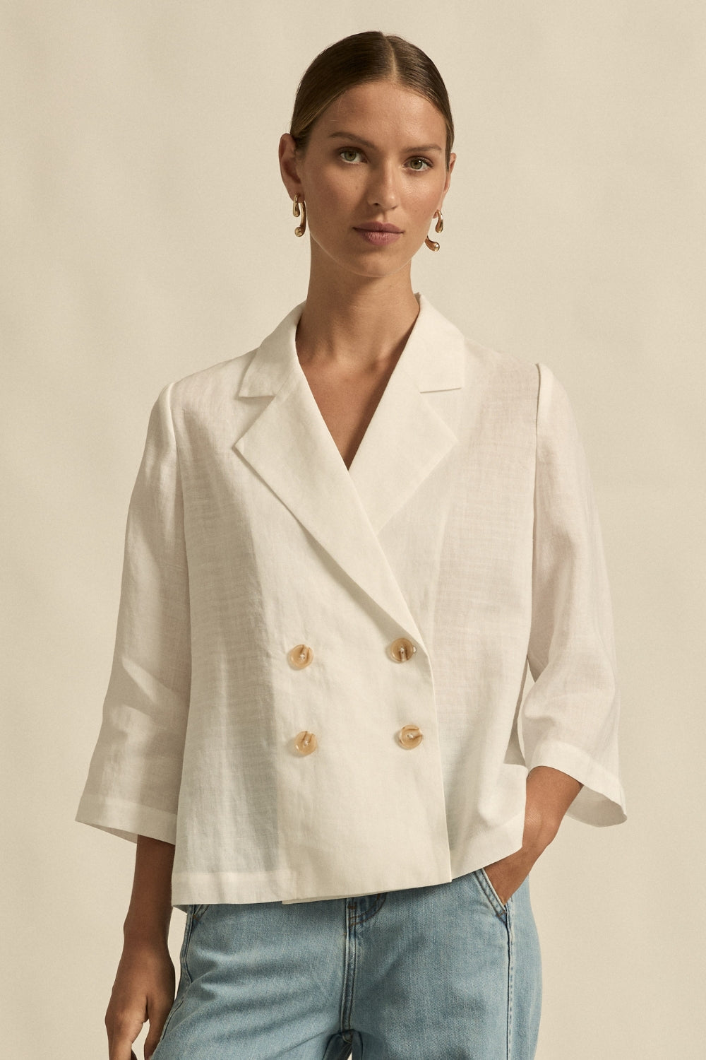 womens double breasted jacket in porcelain worn by model 