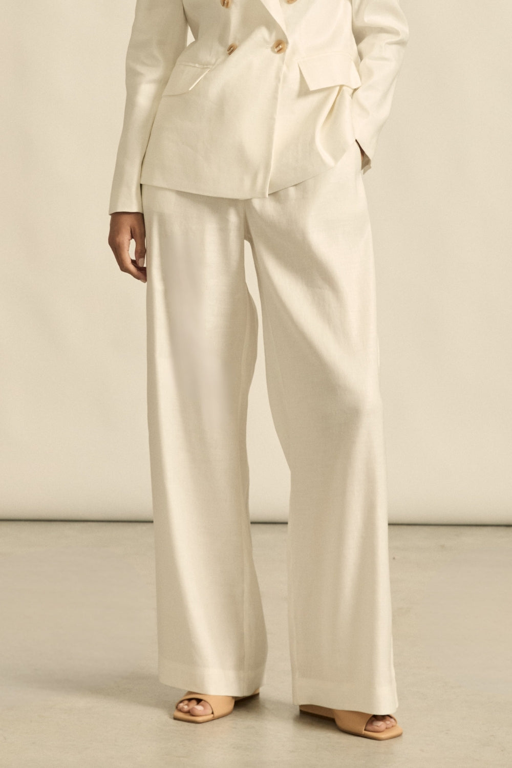 womens off white tailored relaxed pant worn by model 