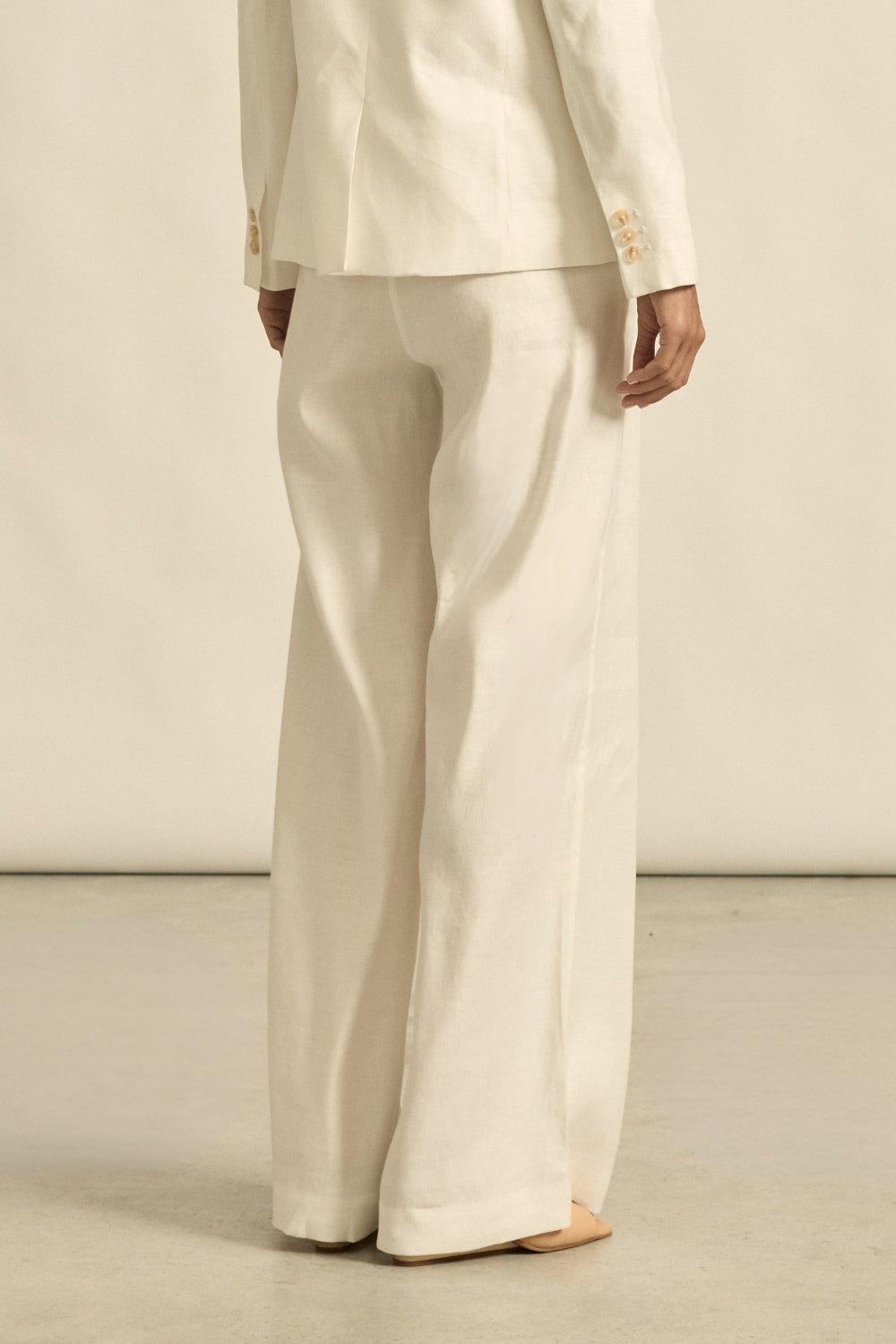 womens off white tailored relaxed pant worn by model back view