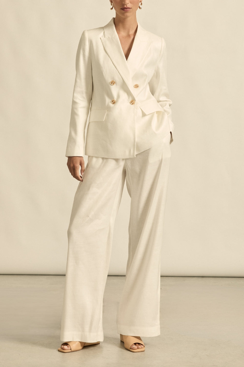 womens off white tailored relaxed pant and jacket worn by model 