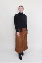 bone and arrow zen waistcoat worn with alquema gold skirt