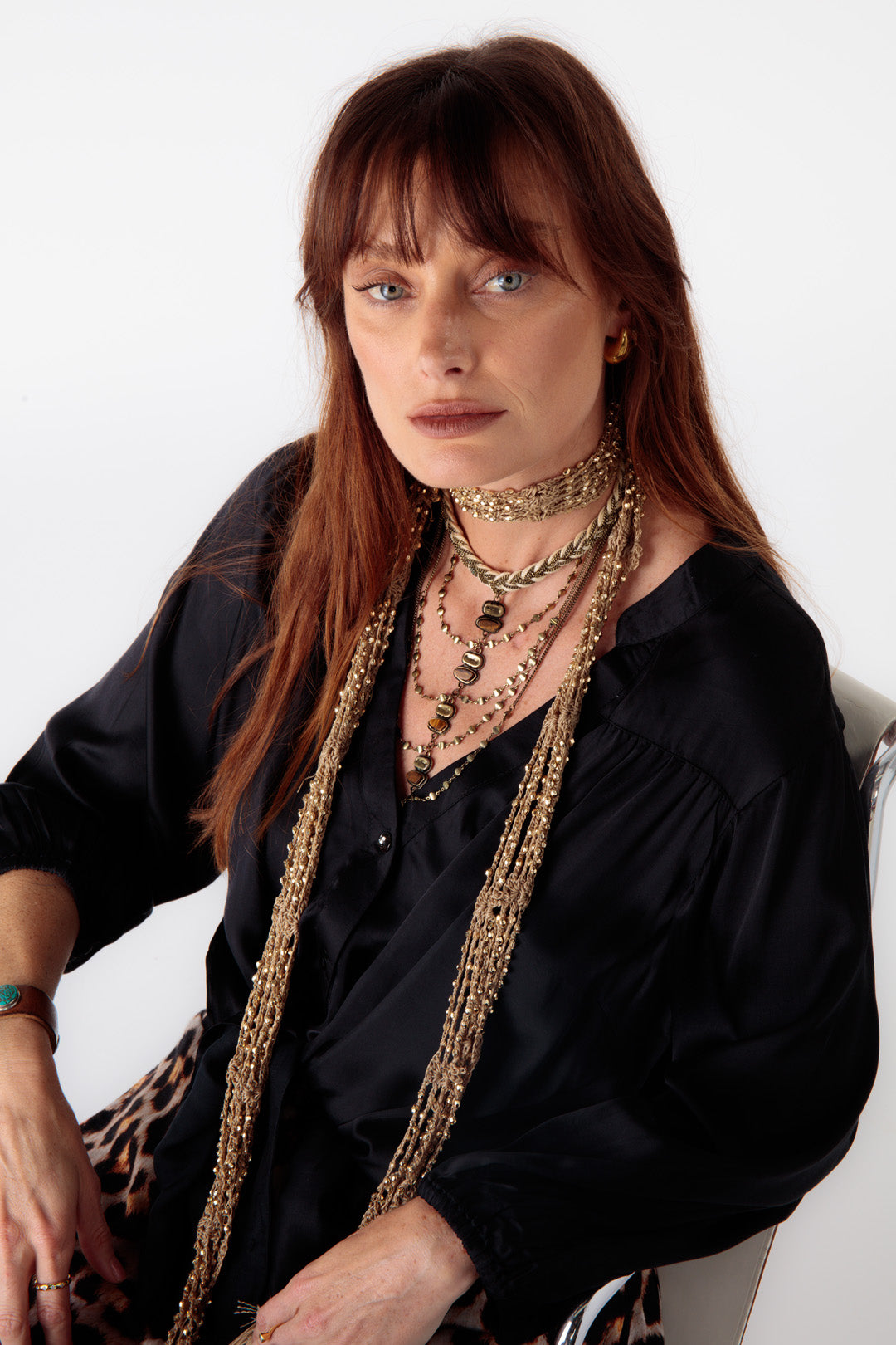 Close-up of elasticated sleeves and button detailing on the Ruby Yaya Gabor Shirt, styled with animal print pants